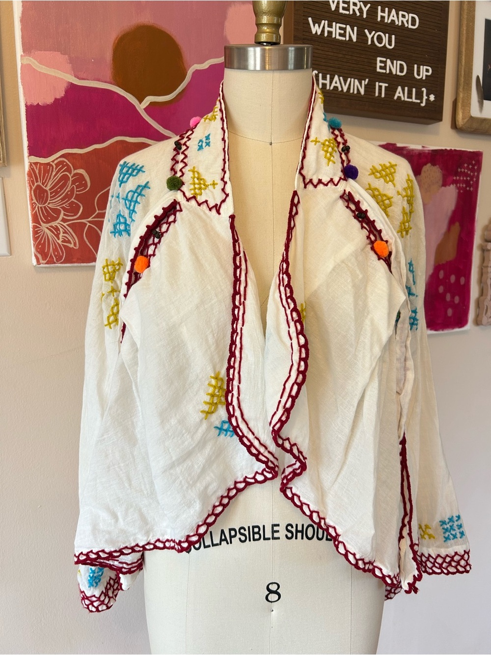 Embroidered White Cotton Jacket with Draped Front and Pom Pom Detail